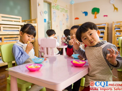 Children eating in front of the furniture