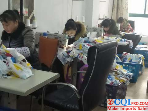 Female workers are working hard on the sewing line