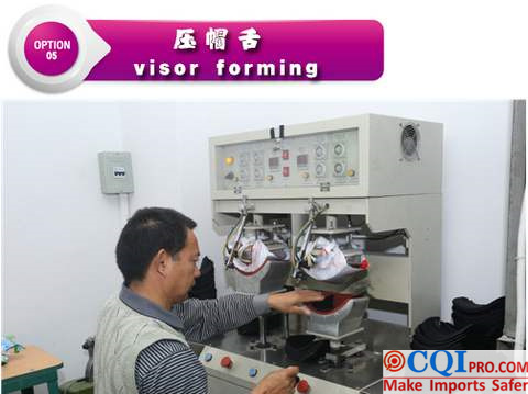 Chinese hat factory workers are using the machine to bend the brim of the hat