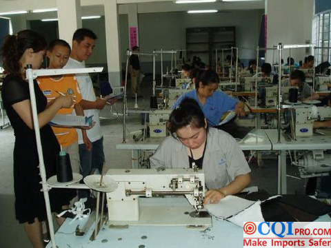 Chinese garment factory workers are sewing garments