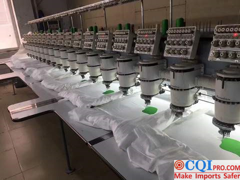 The embroidery machine is embroidering cloth.