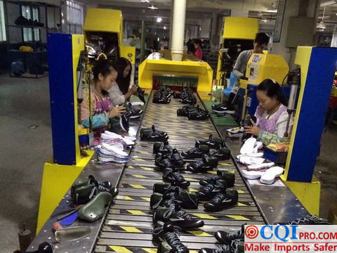 Chinese shoe factory assembly line, workers are making shoes