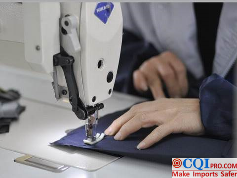 Chinese garment factory workers are sewing garments