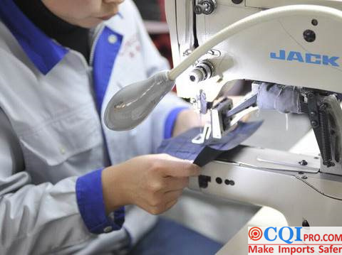 Chinese garment factory workers are sewing garments