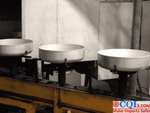 Internal surface spraying of non-stick wok production process