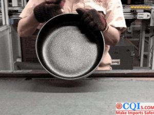 Manual marking of non-stick wok production process